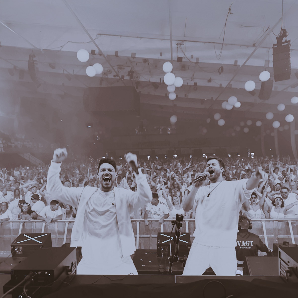 Michael Avenue performing on stage in Denmark with the Topmodelz project at a festival, in front of a crowd of 7,000 people.