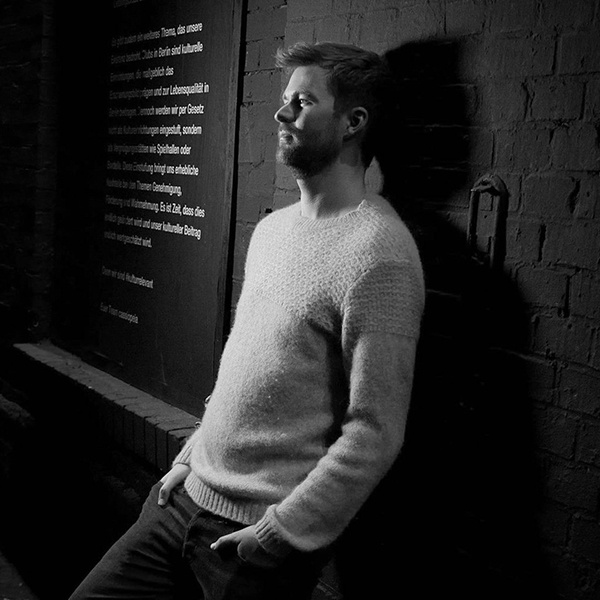 Michael Avenue performing live in Berlin, showcasing his DJ skills at a vibrant event.