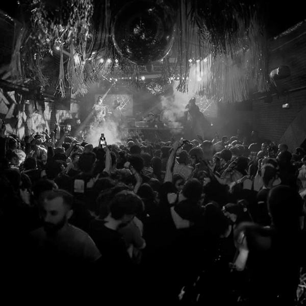 Michael Avenue spinning tracks at an electrifying club event in Berlin as a DJ.