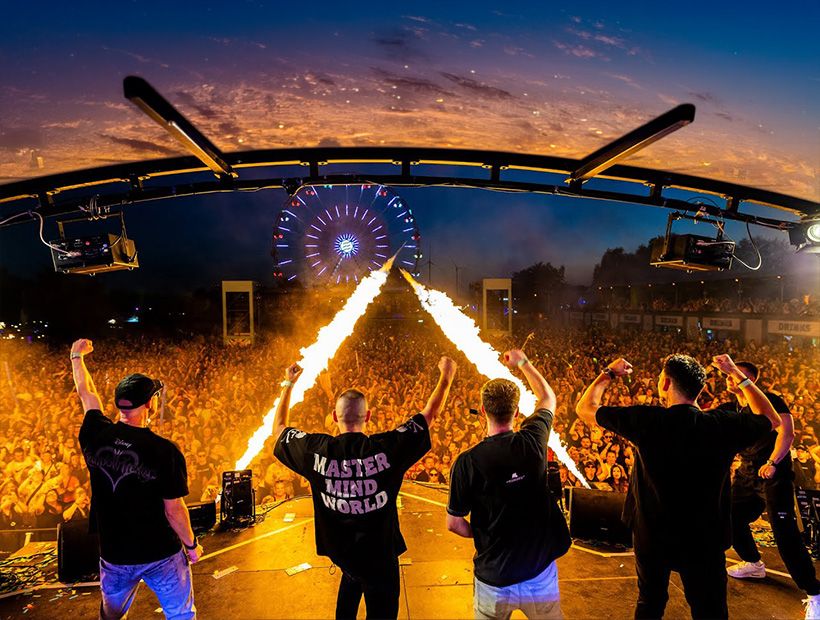 Topmodelz and Da Tweekaz on a festival stage with flame jets in front of a huge crowd